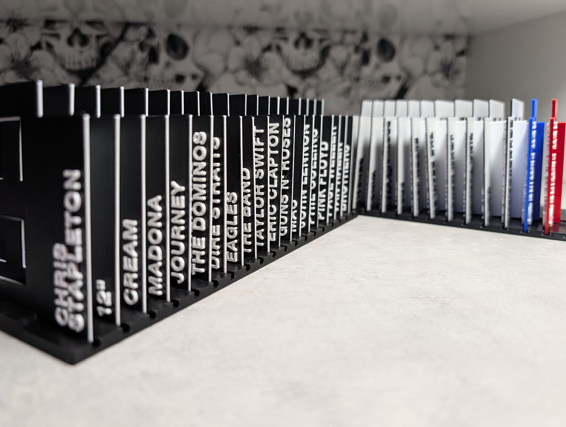 NOIR GrooveGrids dividers arranged in a vinyl collection
